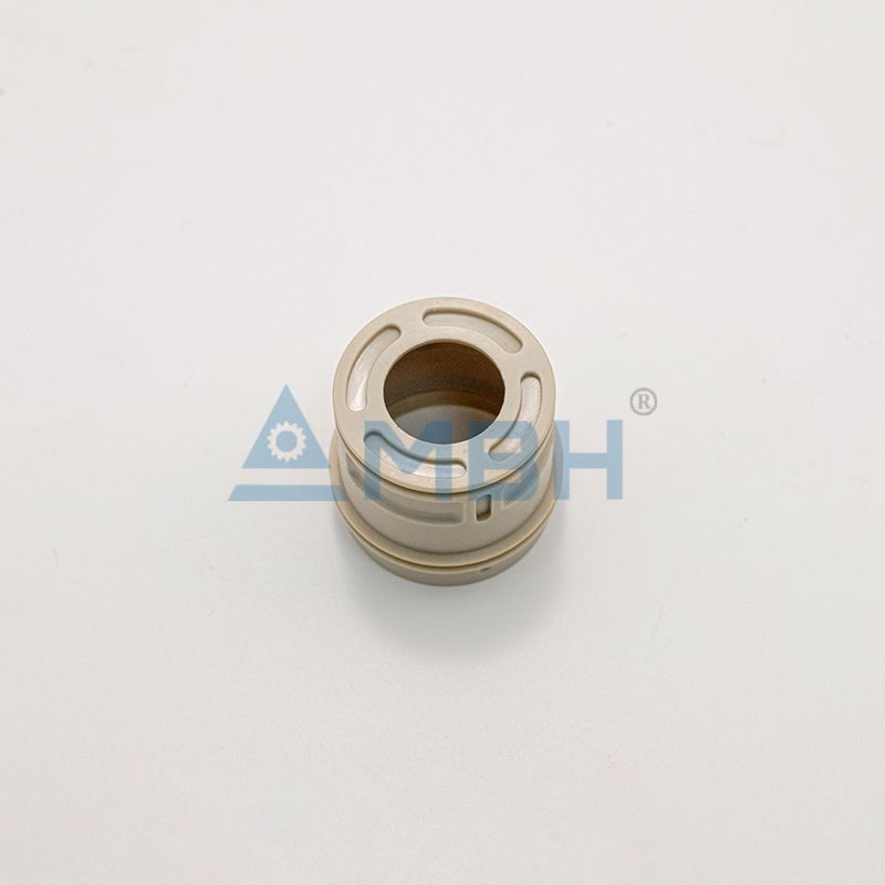 PEEK polyetheretherketone cylindrical housing bushing with slots precision machined structural component by MBH