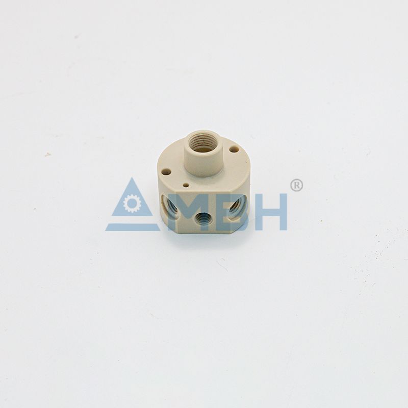 Custom-machined PEEK valve body with threaded ports