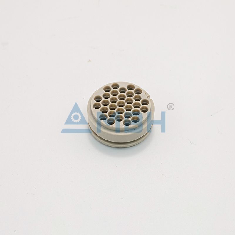PEEK plastic precision machined part with multiple drilled holes