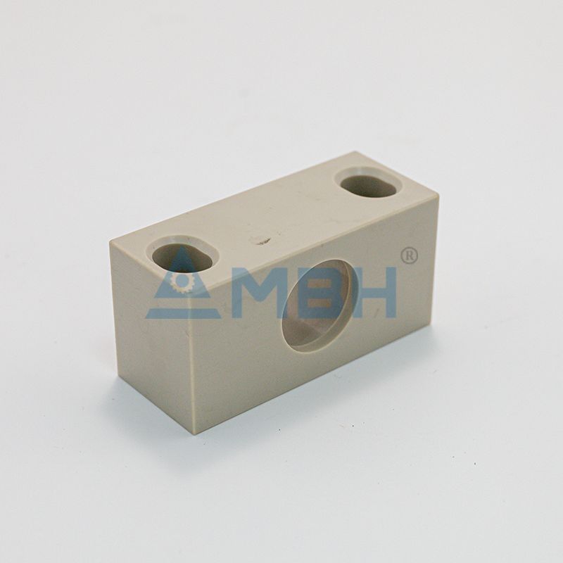 PEEK polyetheretherketone manifold block with through holes precision machined fluid control component by MBH