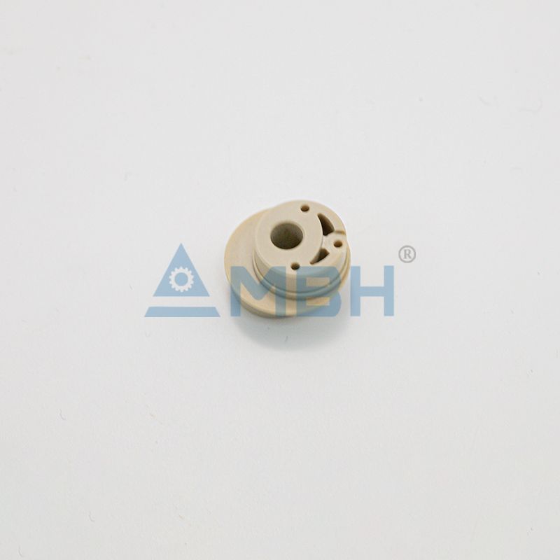 PEEK polyetheretherketone flanged end cap with multiple holes precision machined structural component by MBH